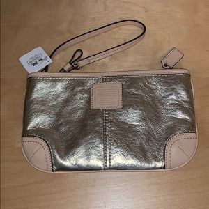 Metallic silver Coach wristlet